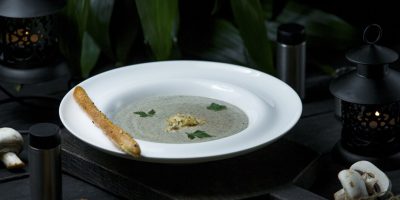 creamy-mushroom-soup-served-with-galette-bread-sticks_114579-1893